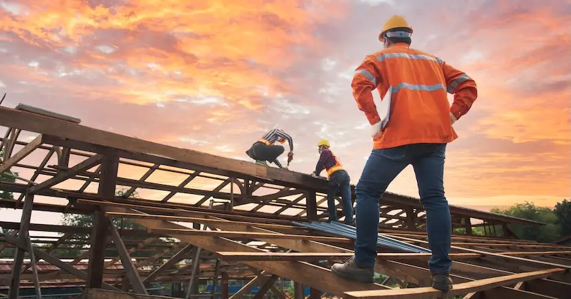 Workers building a house