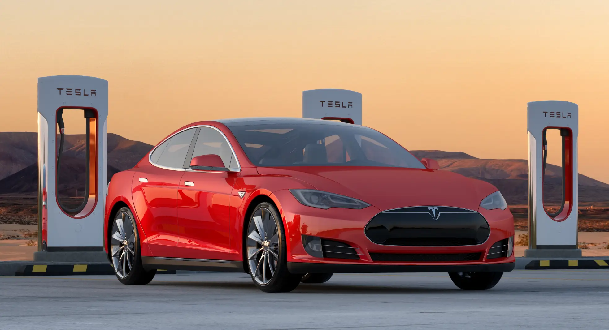 Red Tesla in front of charging station