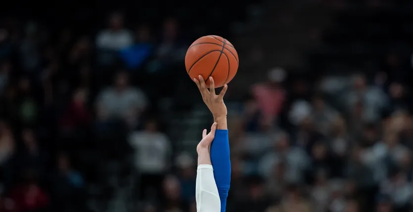 Image of basketball tip-off
