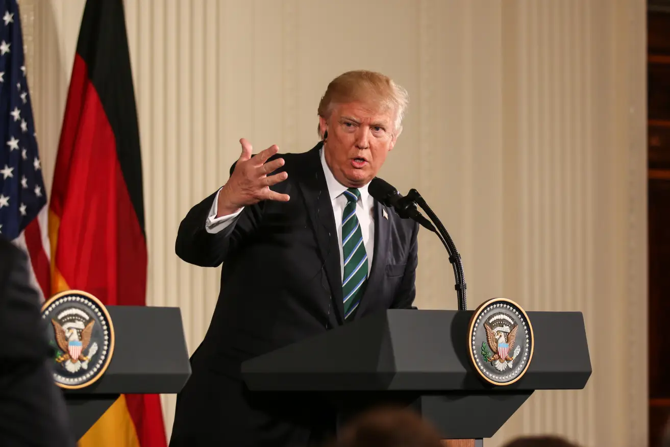 Trump speaking at a podium