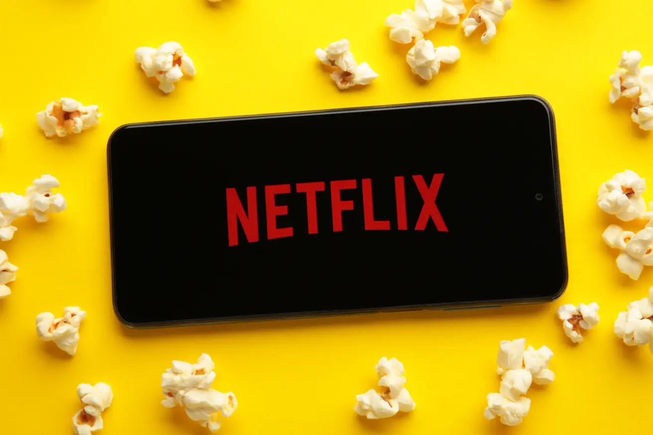 Netflix logo on yellow background with popcorn