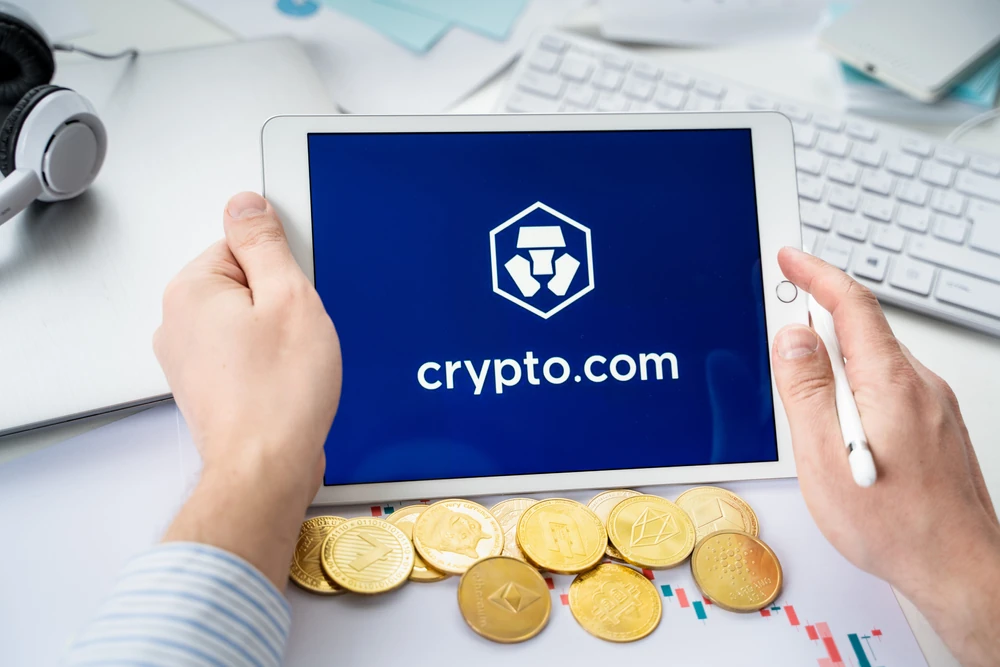 Stock photo of Crypto.com being used with coines below